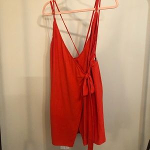 Red spaghetti, strap tie dress with silver hoop design on the back